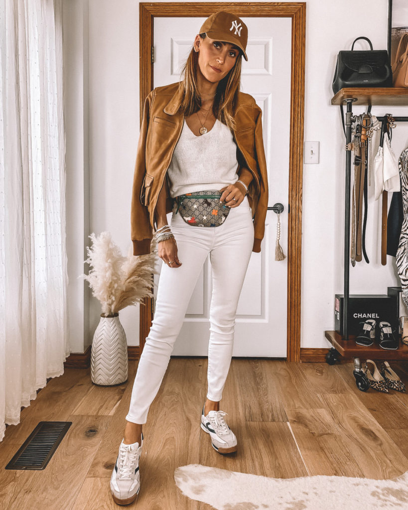 High waisted skinny cropped white jeans Gucci belt bag camel bomber jacket casual street style