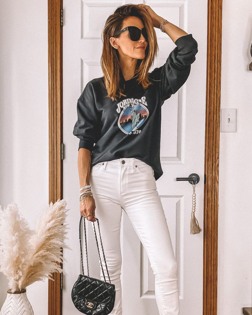 Vintage sweatshirt high waited white jeans black strappy heels casual style