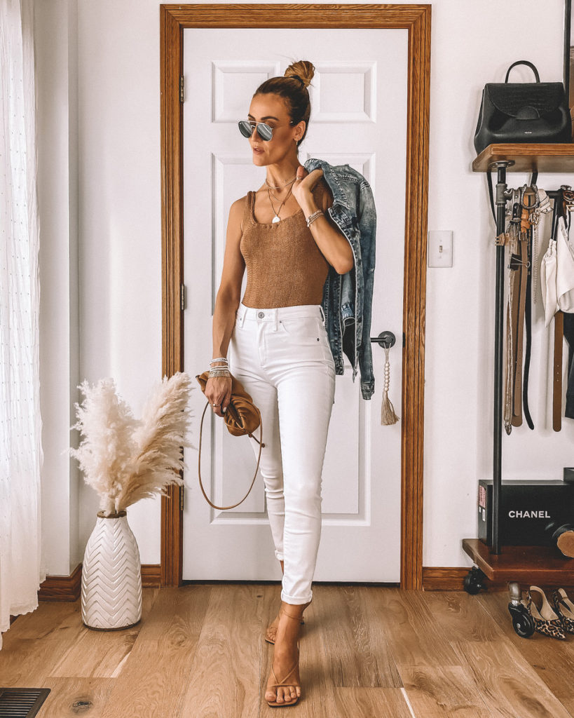 Tan one piece bathing suit styled as a bodysuit white jeans neutral outfit