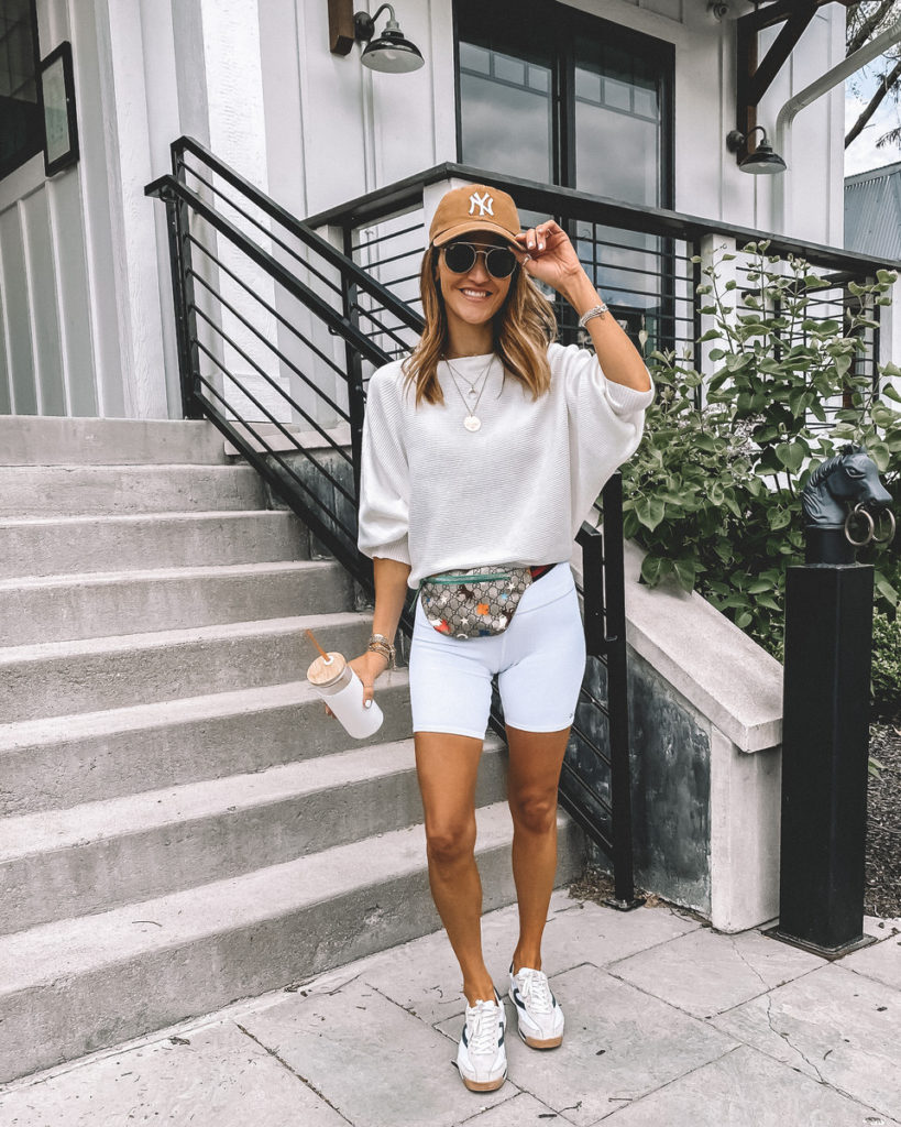 Karina Style Diaries all white outfit biker shorts tan ball cap white sweater belt bag cute sporty outfit  