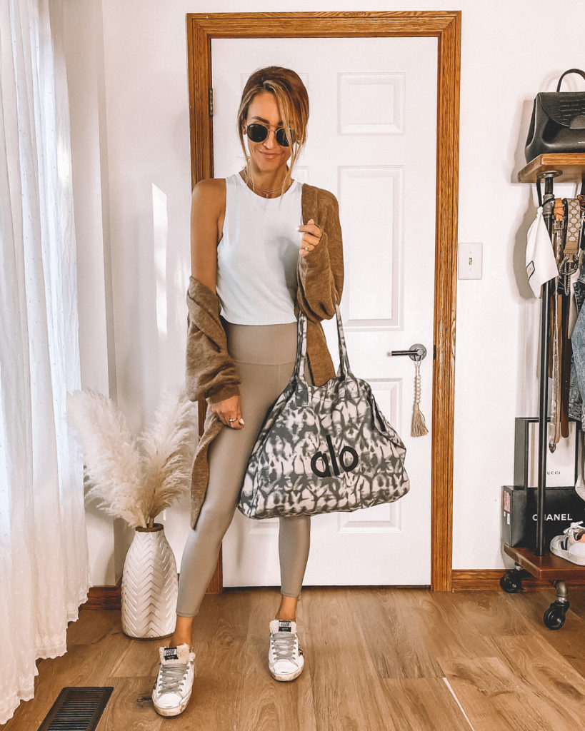 Airlift Leggings styled with cropped top cardigan alo yoga big bag Golden Goose fur sneakers