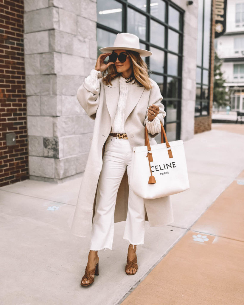 Karina Style Diaries wearing monochromatic cream outfit fall layers in cream Tamara Mellon sandals Celine Canvas logo bag long wool coat fall style 