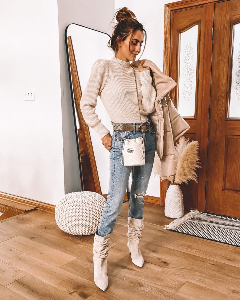 Karina Style Diaries wearing puffer jacket levis skinny jeans shaker puff sleeve slouchy boots gucci bucket bag and belt fall style