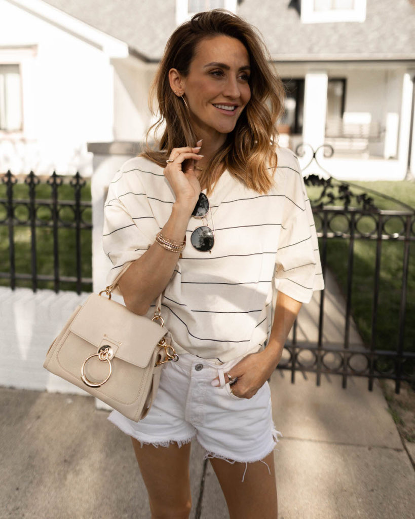 Boxy striped tee and agolde vintage parker shorts, cream loafers