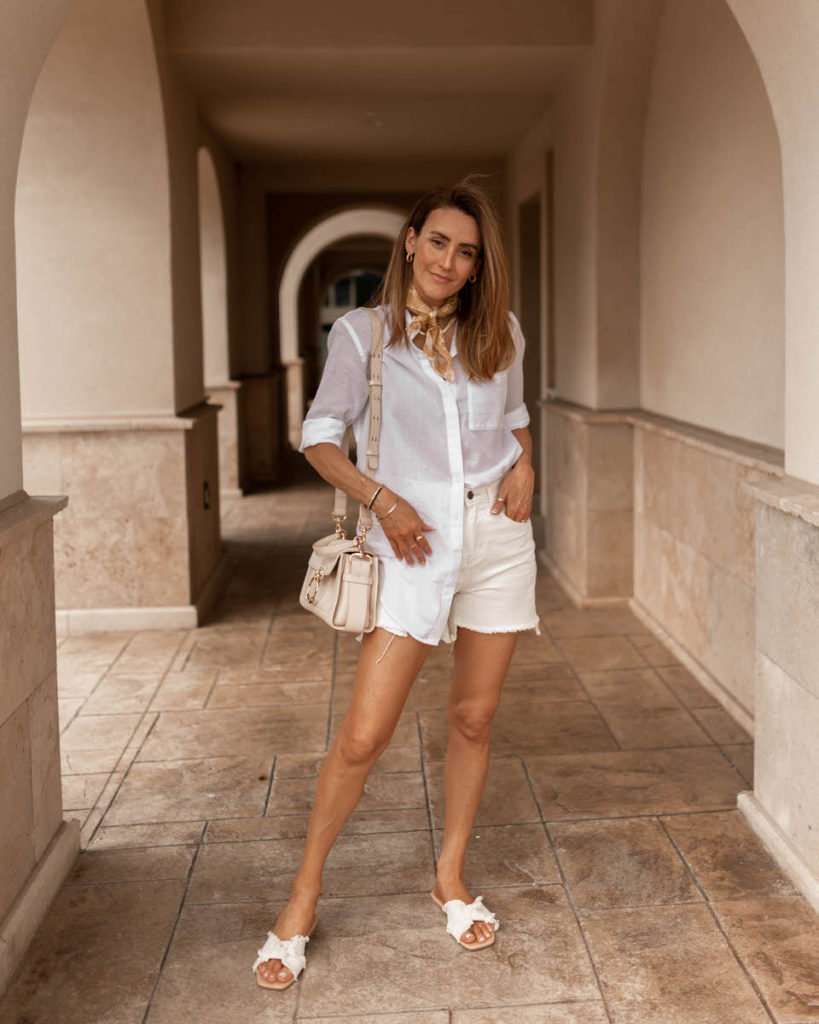 Karina Style Diaries wearing cream shorts, neck scarfsee through cotton shirt, summer outfit