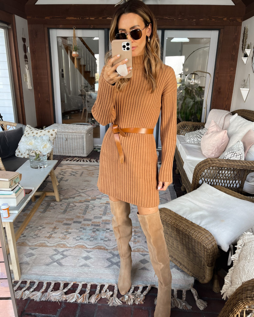 karina wears coated jeans with camel coat and ysl belt bag