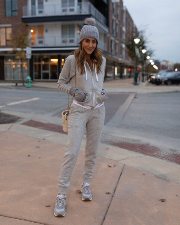 Karina wears Calvin Klein matching jogger zip up hoodie and pom hat ...
