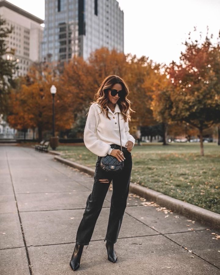 Karina wears schutz black leather bootie with straight leg jean and sweater