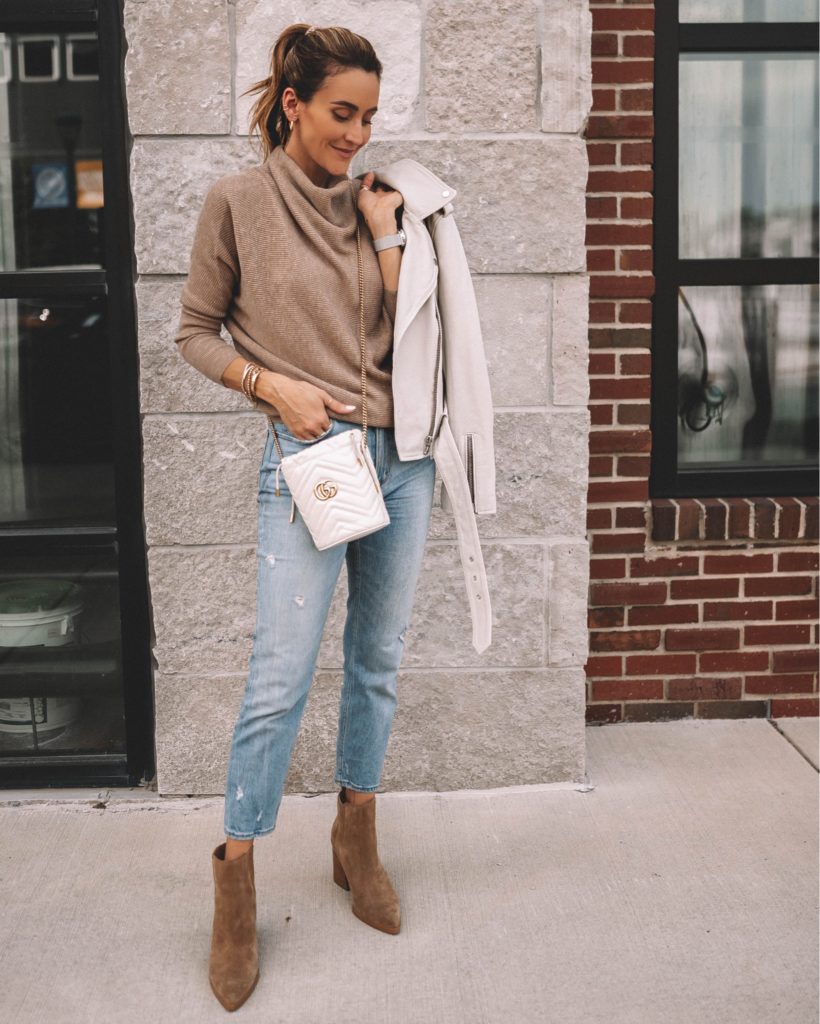 karina wears gucci bucket bag with all saints sweater and jacket