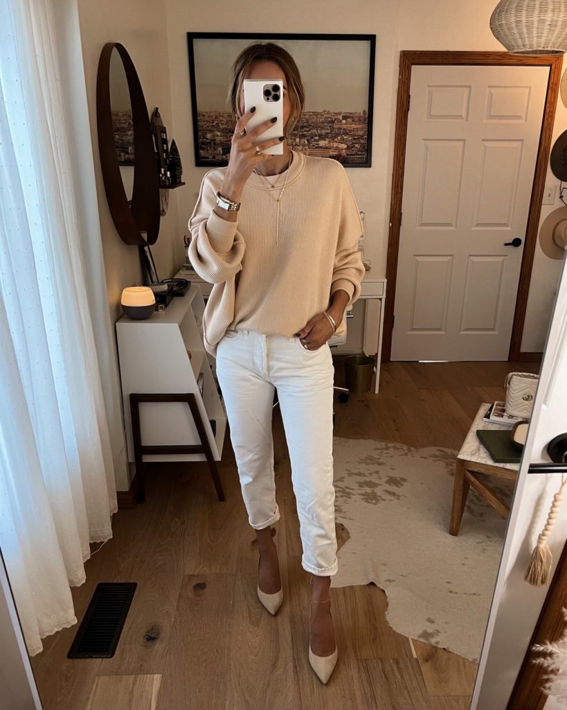 karina wears amazon tan sweater with white pant and sparkly shoe