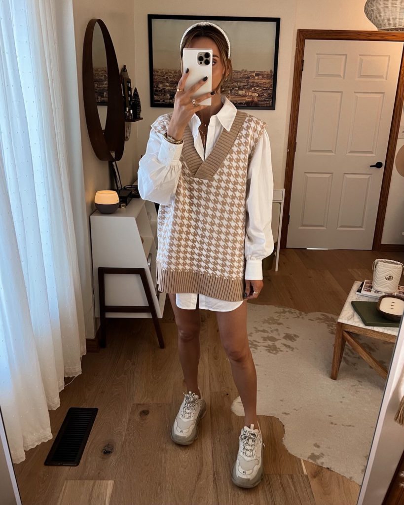 karina wears amazon houndstooth sweater vest dress with button down and sneakers