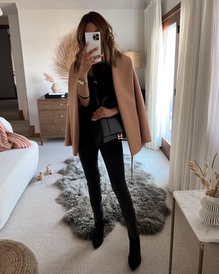 Karina wears all black outfit with express camel coat