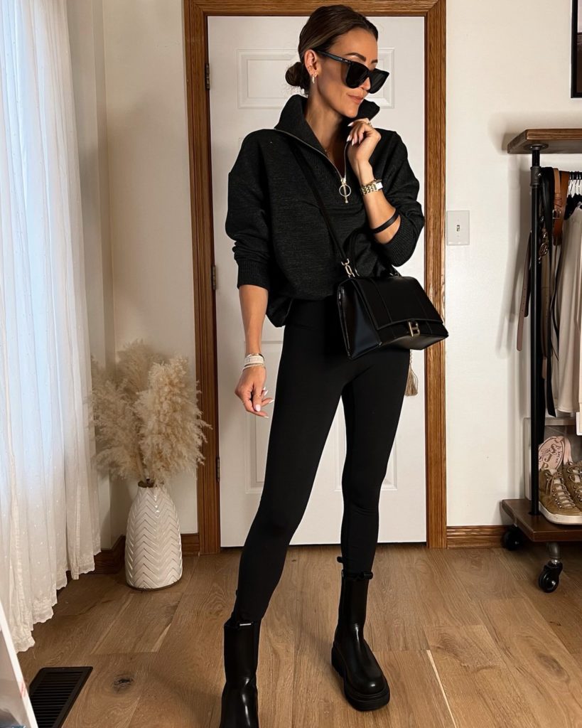karina wears black varley set with varley pullover