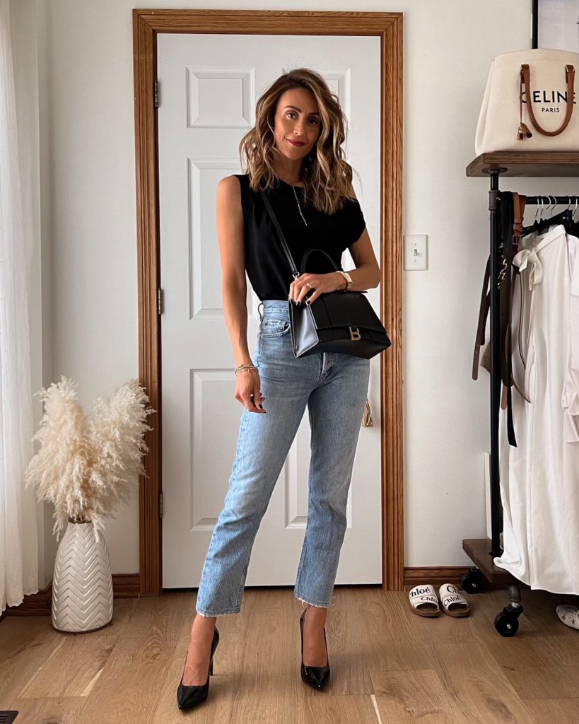 karina wears balenciaga hourglass bag with off the shoulder top and agolde denim
