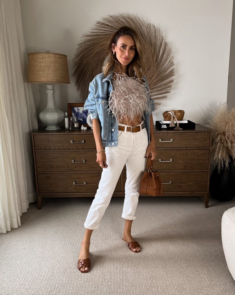 Karina wears lamarque feather top with white jeans and denim jacket