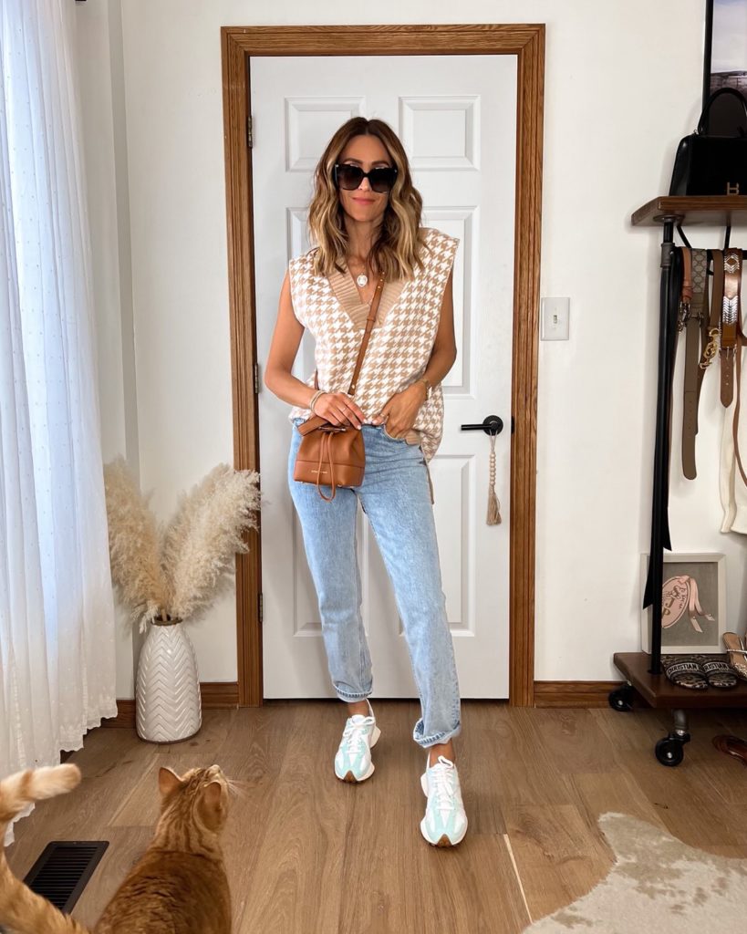 Karina wears amazon oversized sweater vest with abercrombie jeans and white sneakers