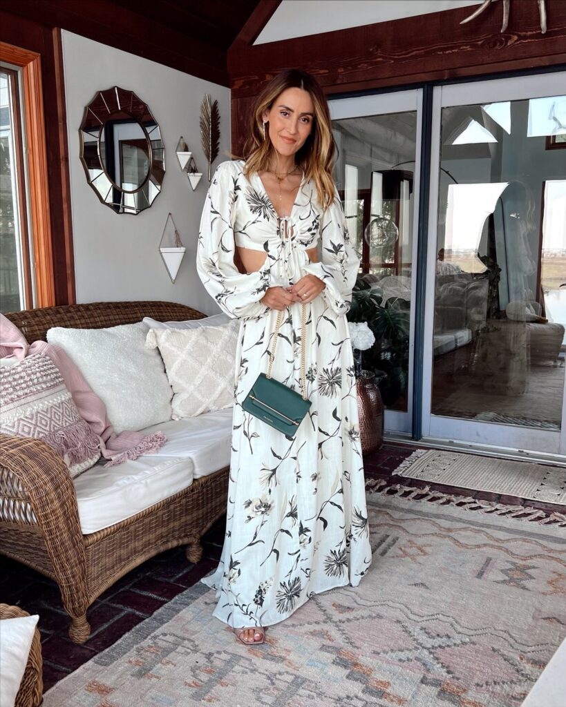 karina wears black and white floral maxi dress with cutouts from nordstrom