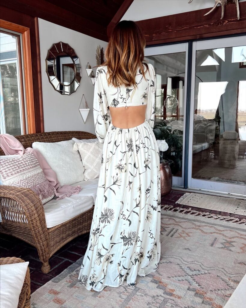 karina wears black and white floral maxi dress with cutouts from nordstrom
