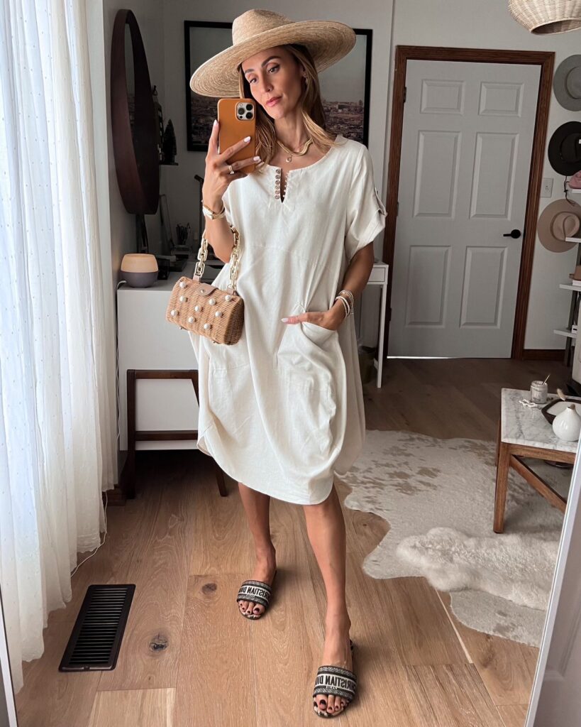 Karina wears amazon cream oversized short sleeve dress with lack of color had and dior slides