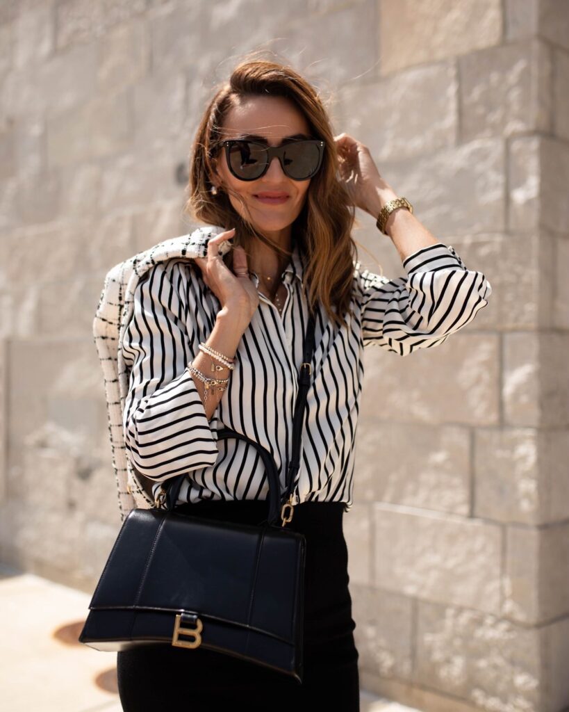 karina wears express striped buttondown with black pencil skirt and balenciaga hourglass handbag