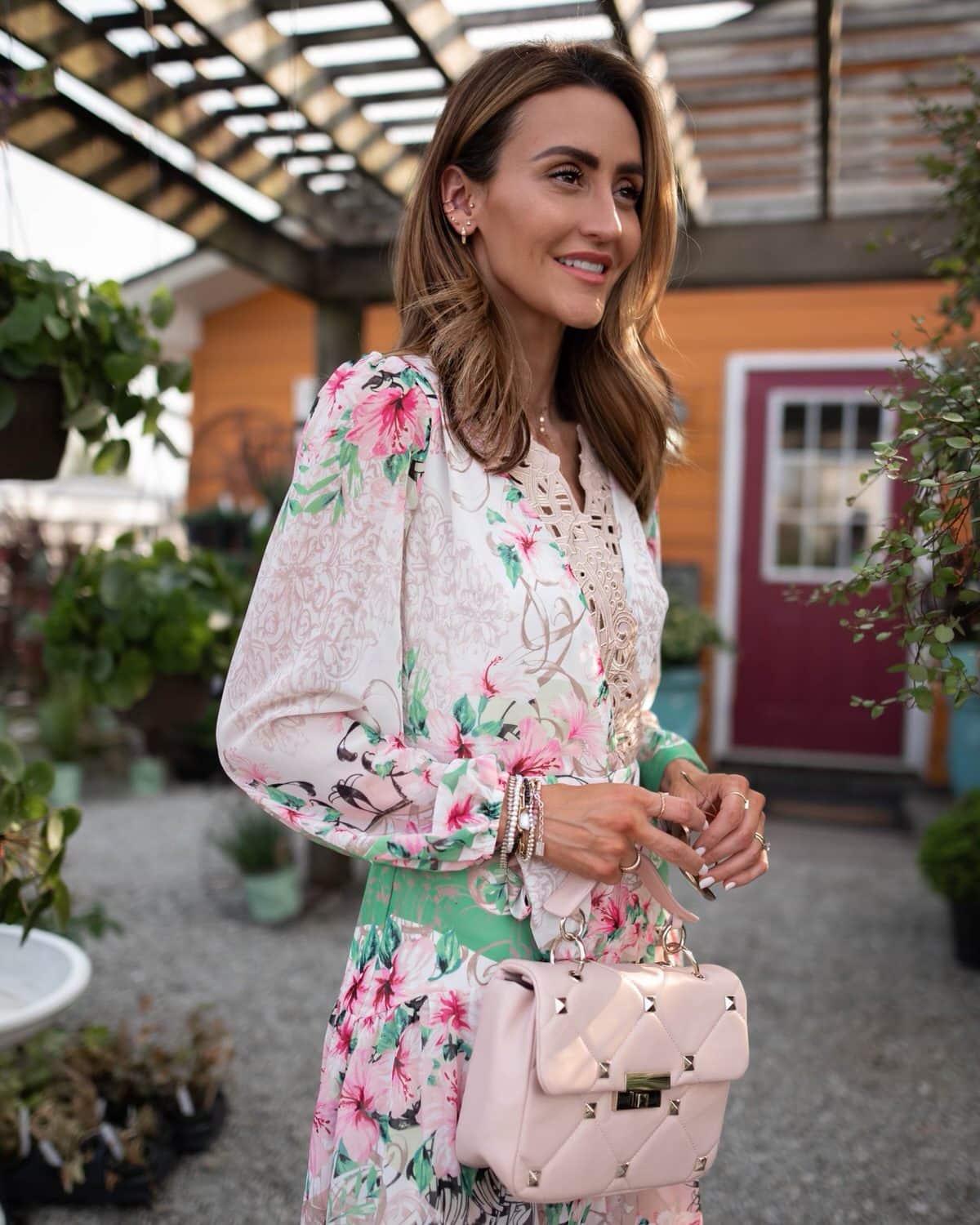 karina wears white house black market floral maxi dress with pink handbag