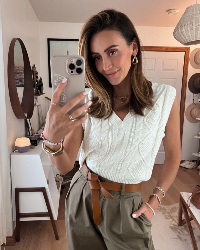 Karina wears amazon loose fit olive pant with white sweater vest