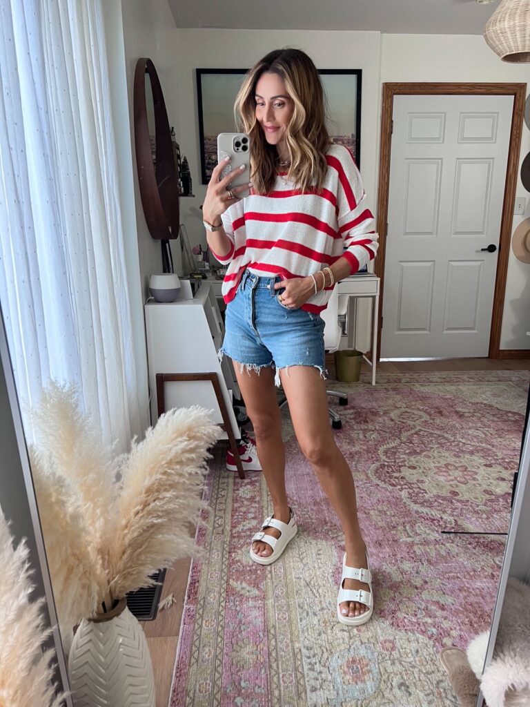 Karina wears gucci dad sandal with denim shorts and striped sweater