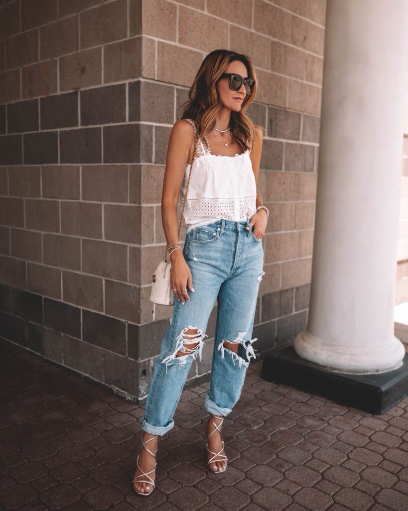 Karina wears JLO metallic sandals with agolde jeans and heartloom tank