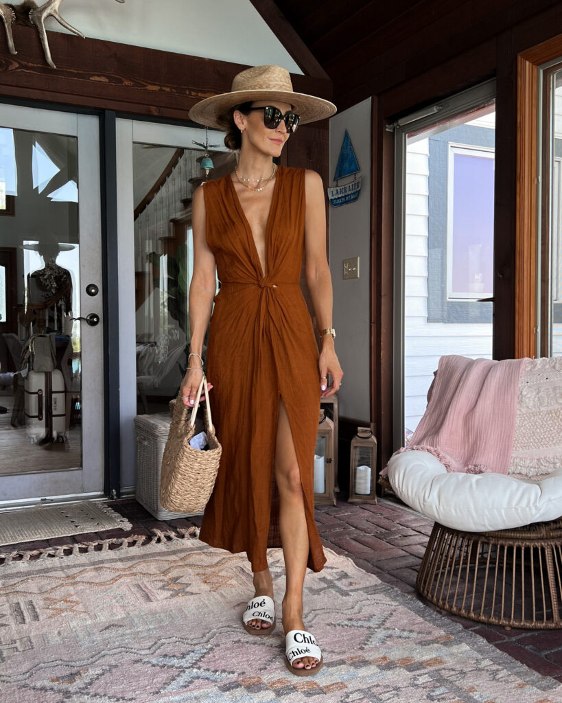 karina wears l space bathing suit cover up with lack of color sun hat