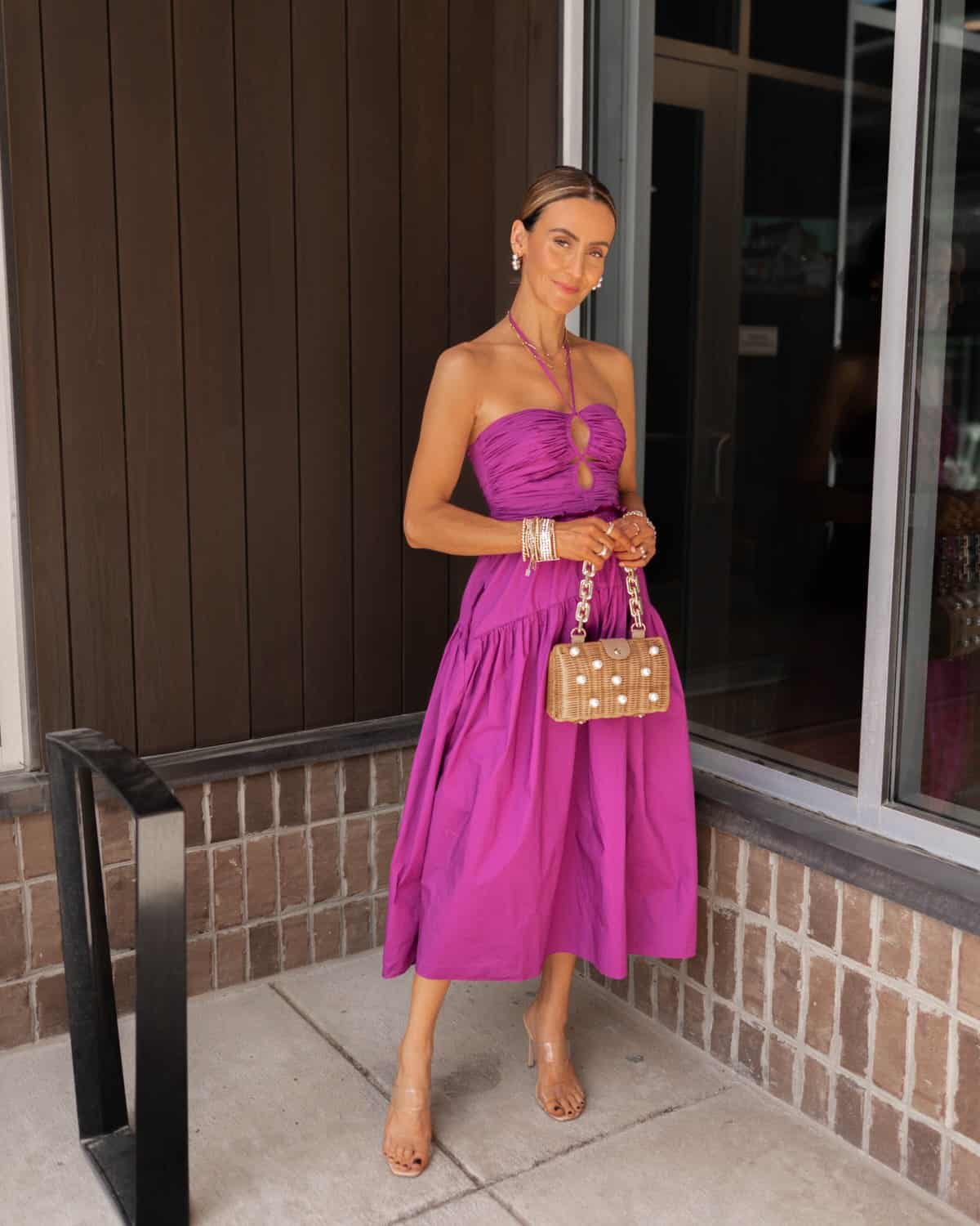 karina wears pink ulla johnson midi dress with wicker bag