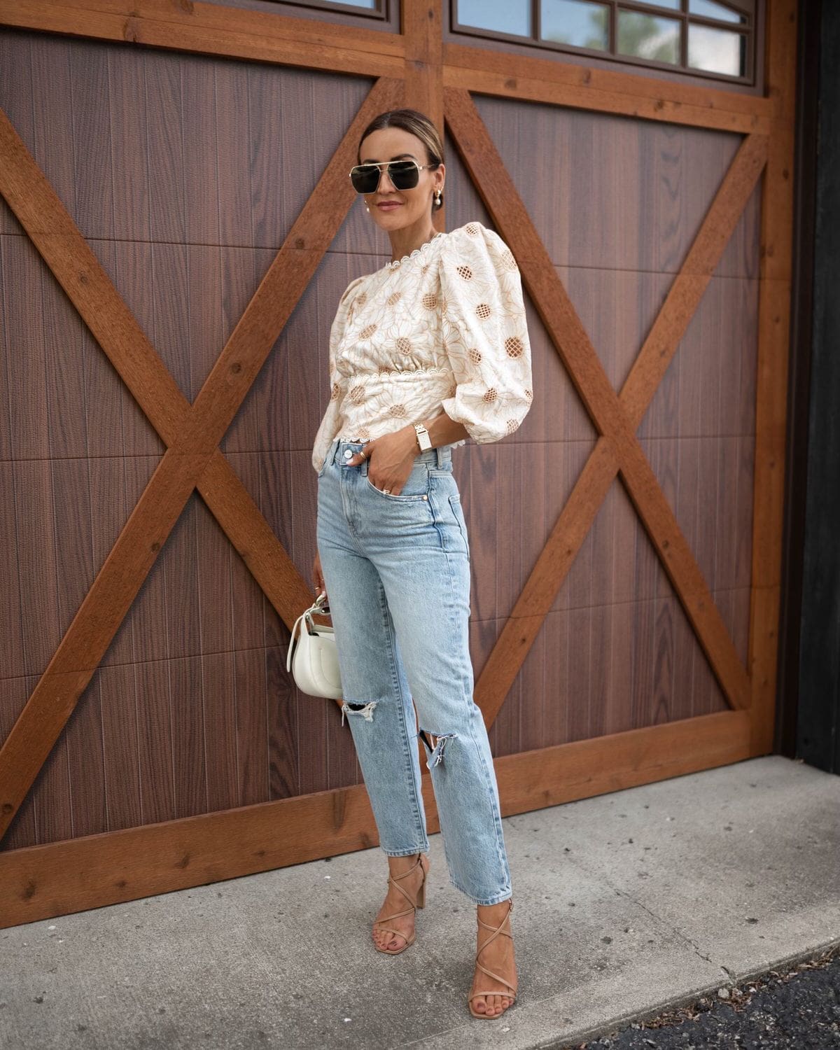 karina wears express jeans with embroidered top