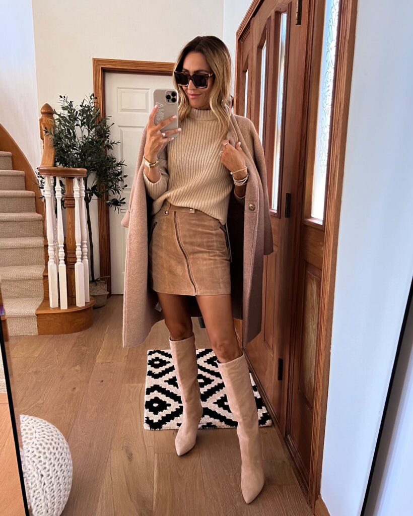 karina wears tan suede mini skirt with sweater and boots