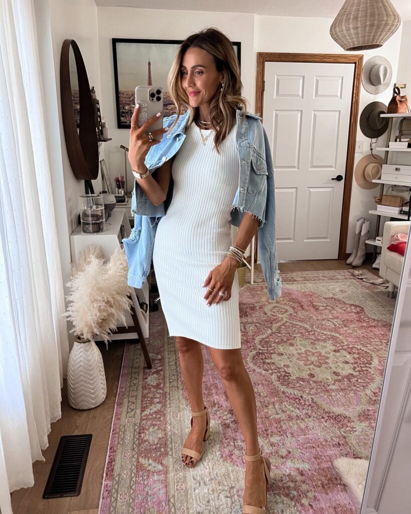 karina wears pink lily ribbed midi dress in white with distressed denim jacket
