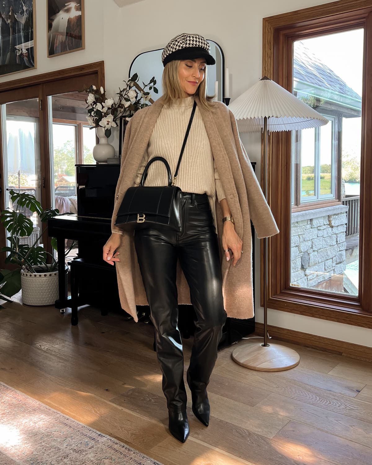 Karina wears leather pants with Vince sweater and cardi coat