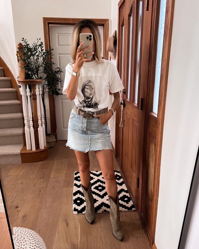 Karina wears Anine Bing graphic tee with jean skirt