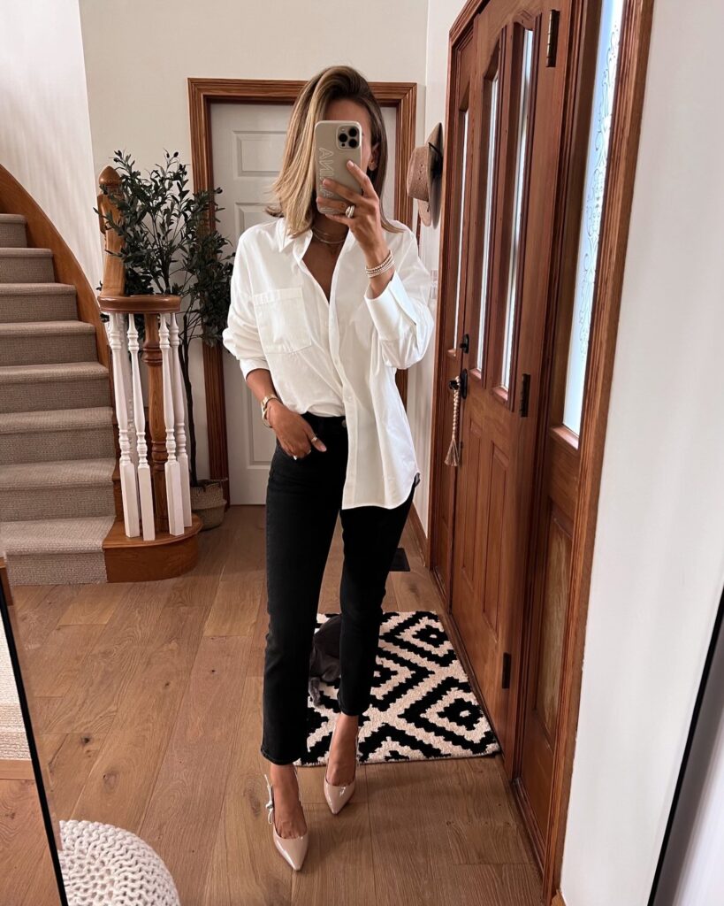 Karina wears Anine Bing button down with black jeans
