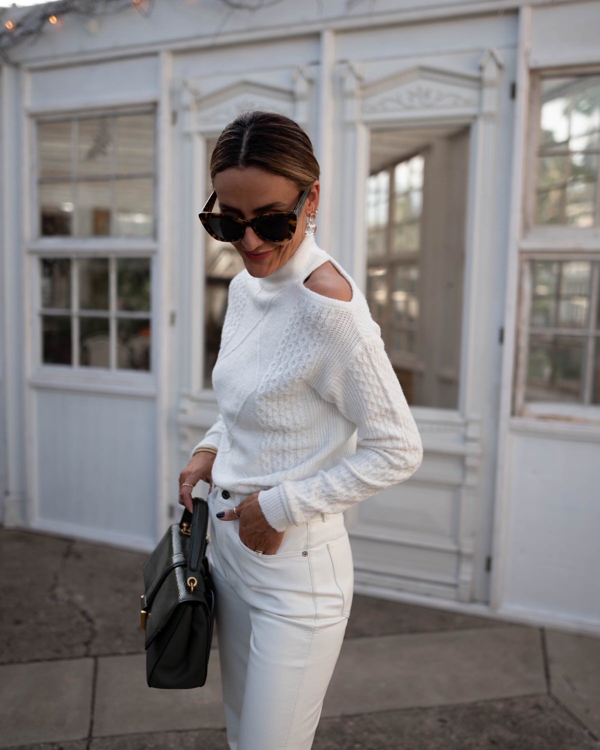 Karina wears Walmart white sweater with Agolde white leather pants
