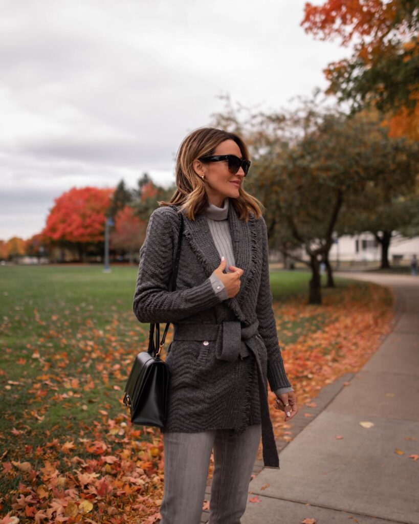 Karina wears WHBM grey sweater coat with grey jeans and balenciaga hourglass bag
