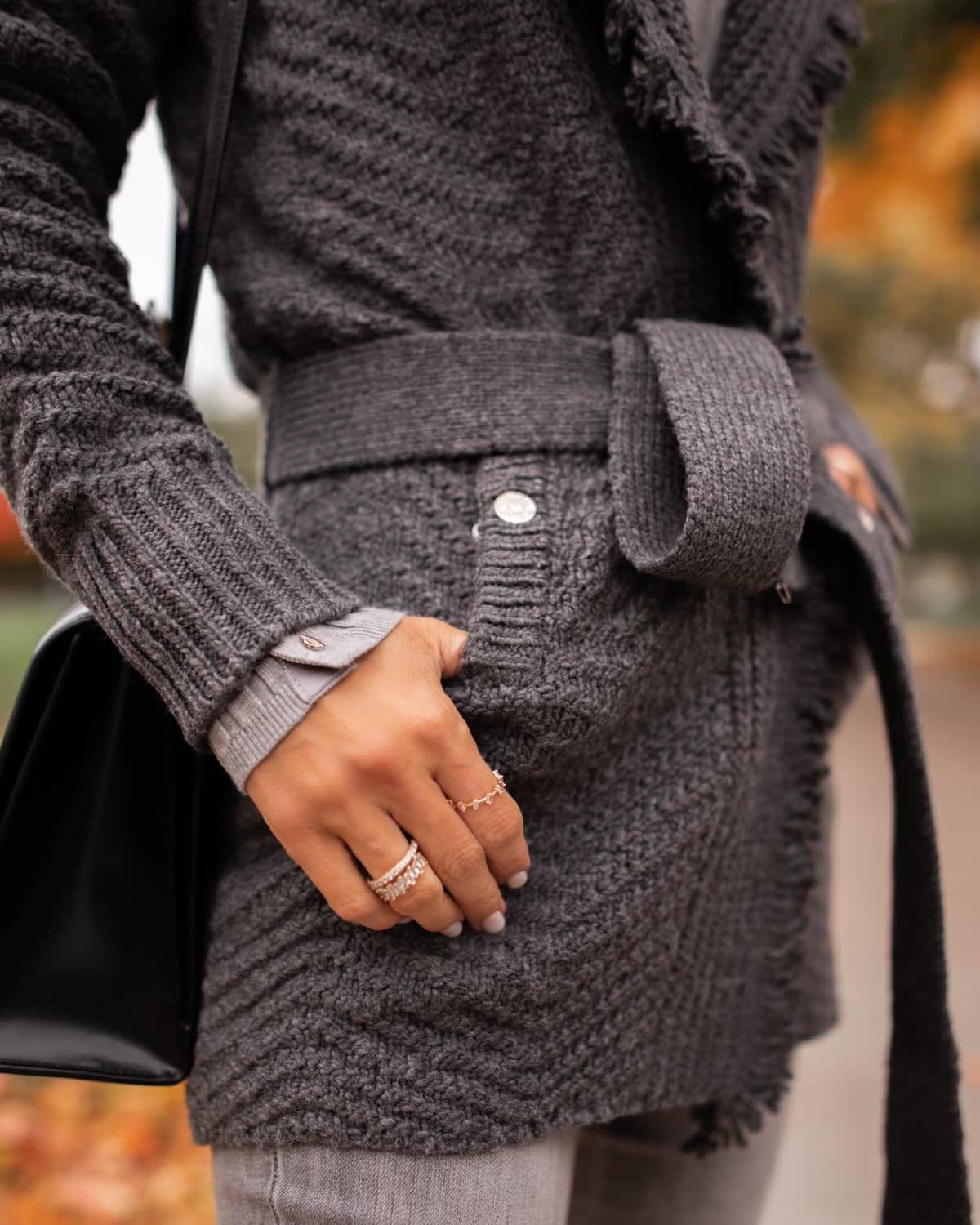 Karina wears WHBM grey sweater coat with grey jeans and balenciaga hourglass bag