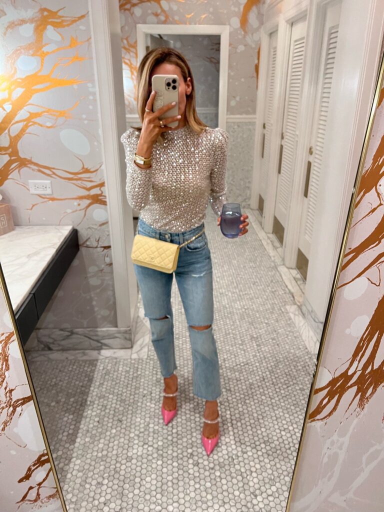 Karina wears Revolve sequin top with GRLFRND jeans and jimmy choo pumps