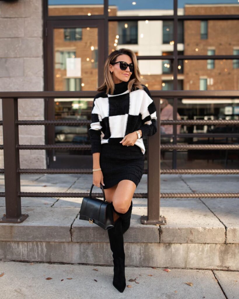 Karina wears Bloomingdale's white and black checkered sweater with black mini skirt and boots