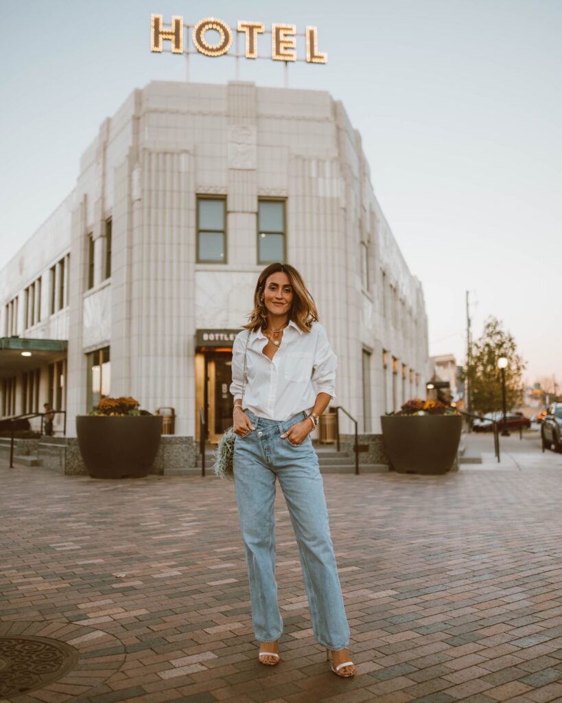 Karina wears agolde jeans with anine bing button down