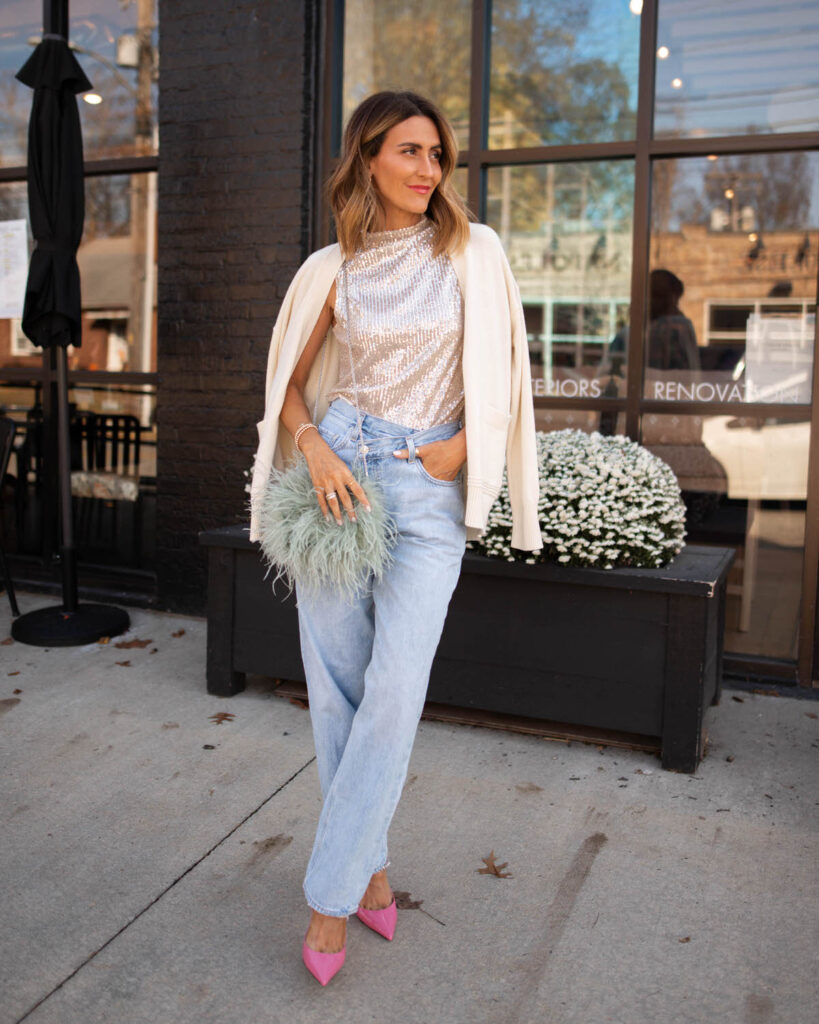 Karina wears Nordstrom sequin top with agolde criss cross jeans