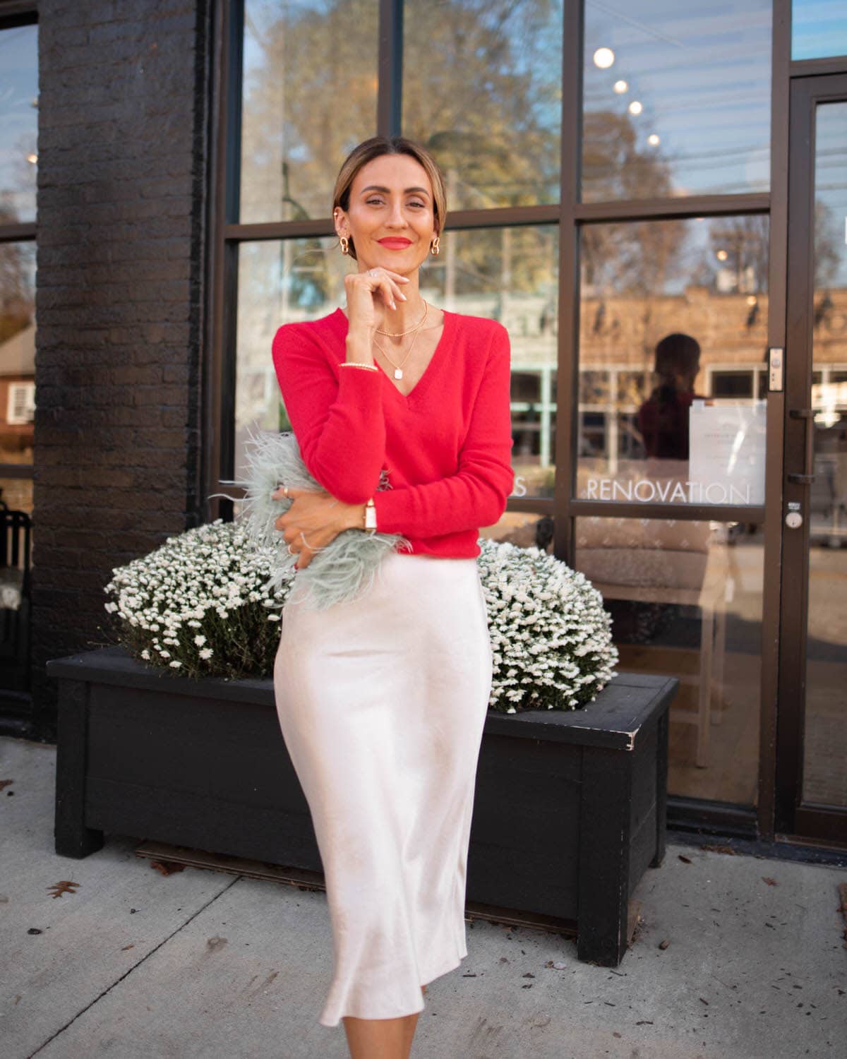 Karina wears Nordstrom red cashmere sweater with vince silk slip skirt