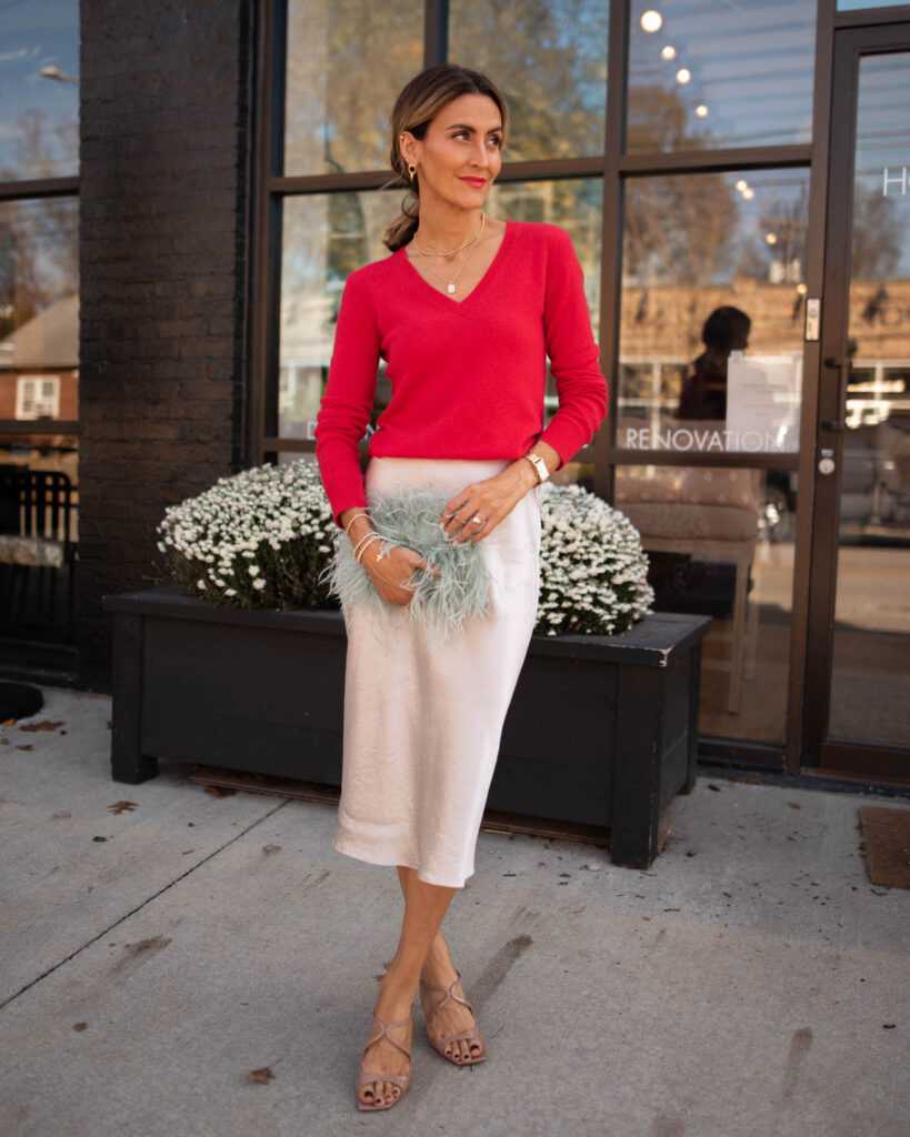 Karina wears Nordstrom red cashmere sweater with vince silk slip skirt