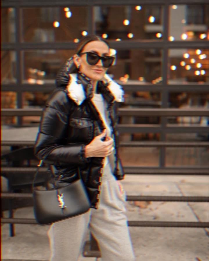 Karina wears black puffer moncler jacket and ysl handbag