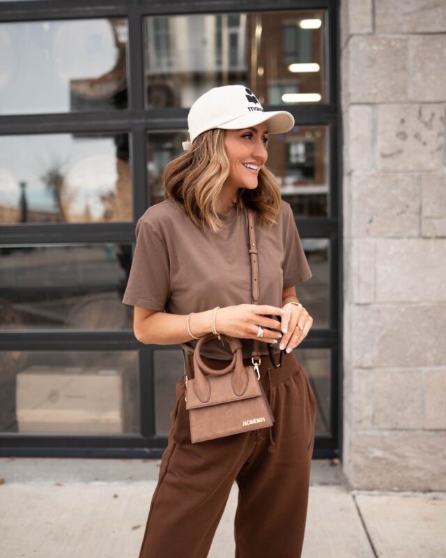 Karina wears Nike brown joggers and slouchy t shirt