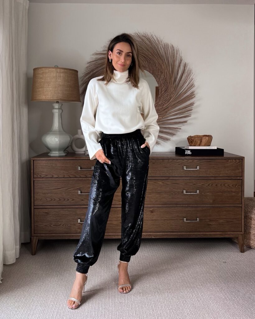 Karina wears evereve sweater with sequin joggers