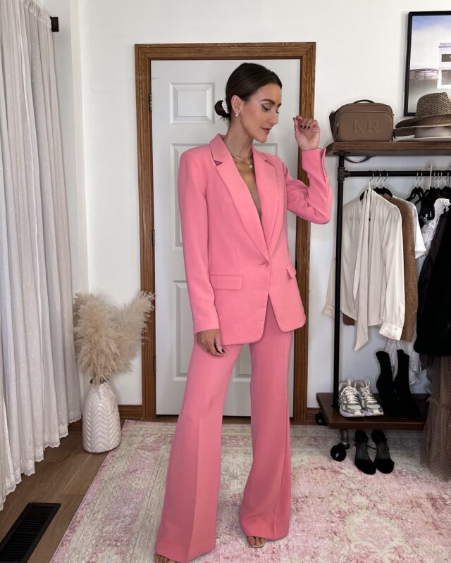 Karina wears Express pink twill suit