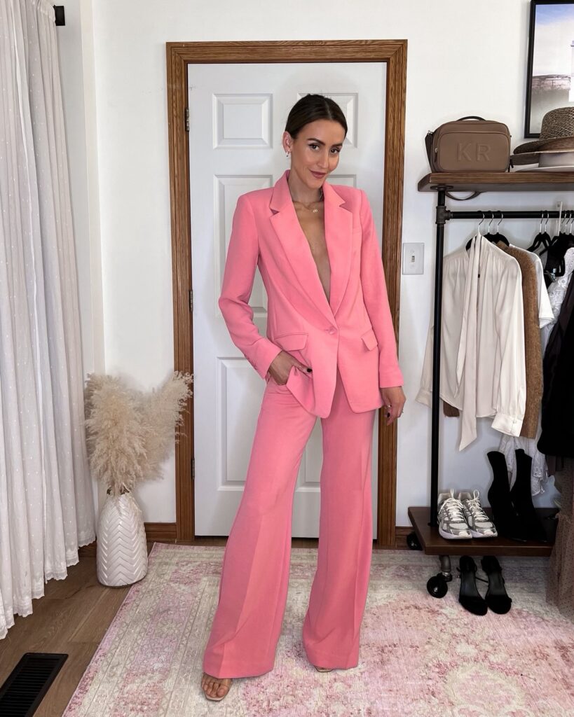 Karina wears Express pink twill suit